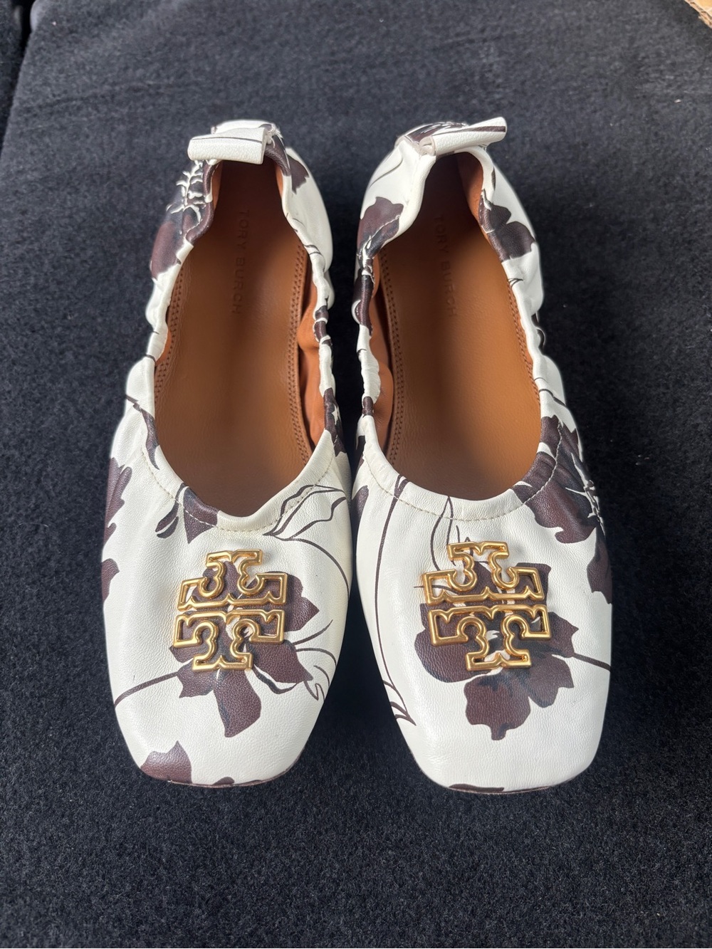 Tory Burch White Floral Logo Ballet Flats with Gold Emblem
